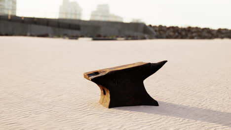 Old-anvil-on-a-sandy-beach