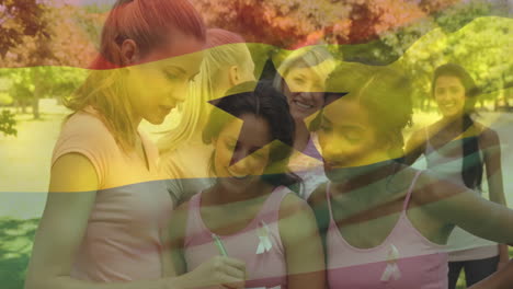 mujeres con camisas rosadas con cintas sobre la animación de la bandera de ghana