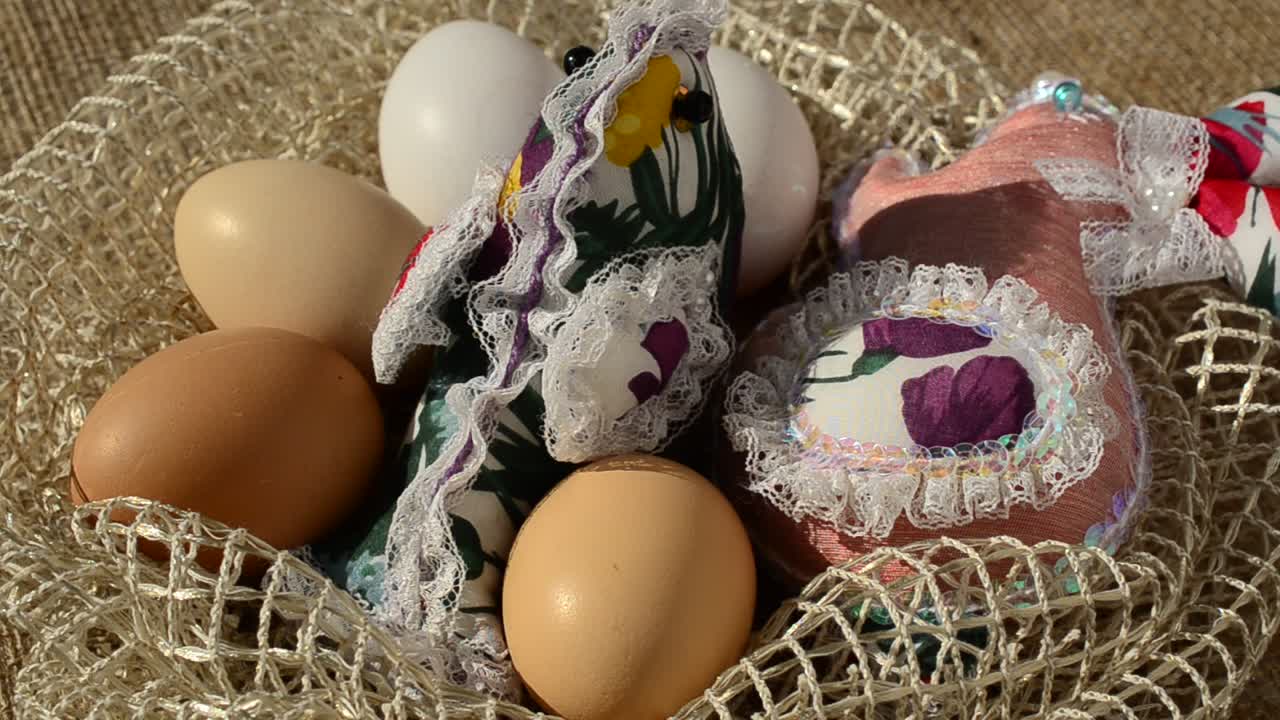 Eggs in a basket against a sacking. Easter still life