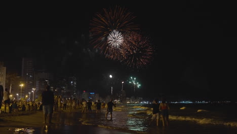 fireworks over the beach at night