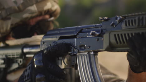 Soldier handling an AK-47 rifle
