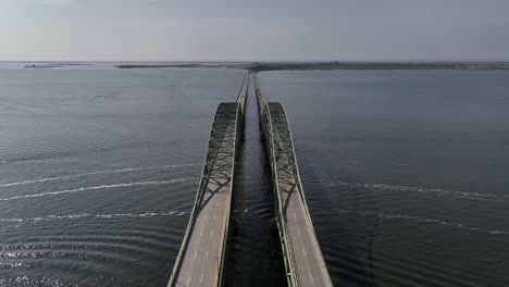 an aerial view of the robert moses causeway and the great south bay bridge on a beautiful day