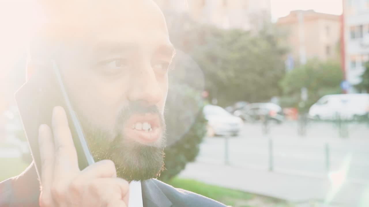 Man talking on mobile phone outdoors