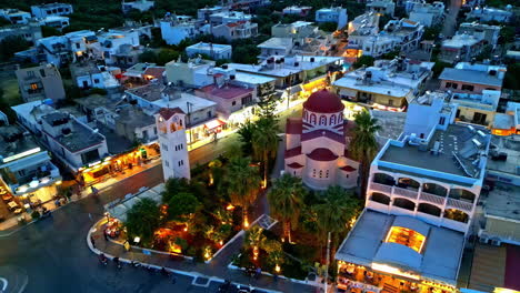 aerial view in front of a greek church, dusk in elounda, crete, greece