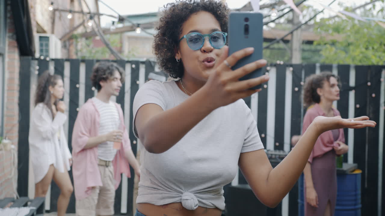 Friends Taking a Selfie at a Backyard Party