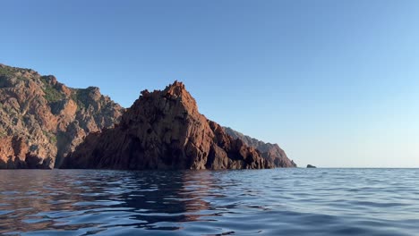 Scandola-UNESCO-nature-reserve-tour-boat-in-summer-season,-Corsica-island-in-France