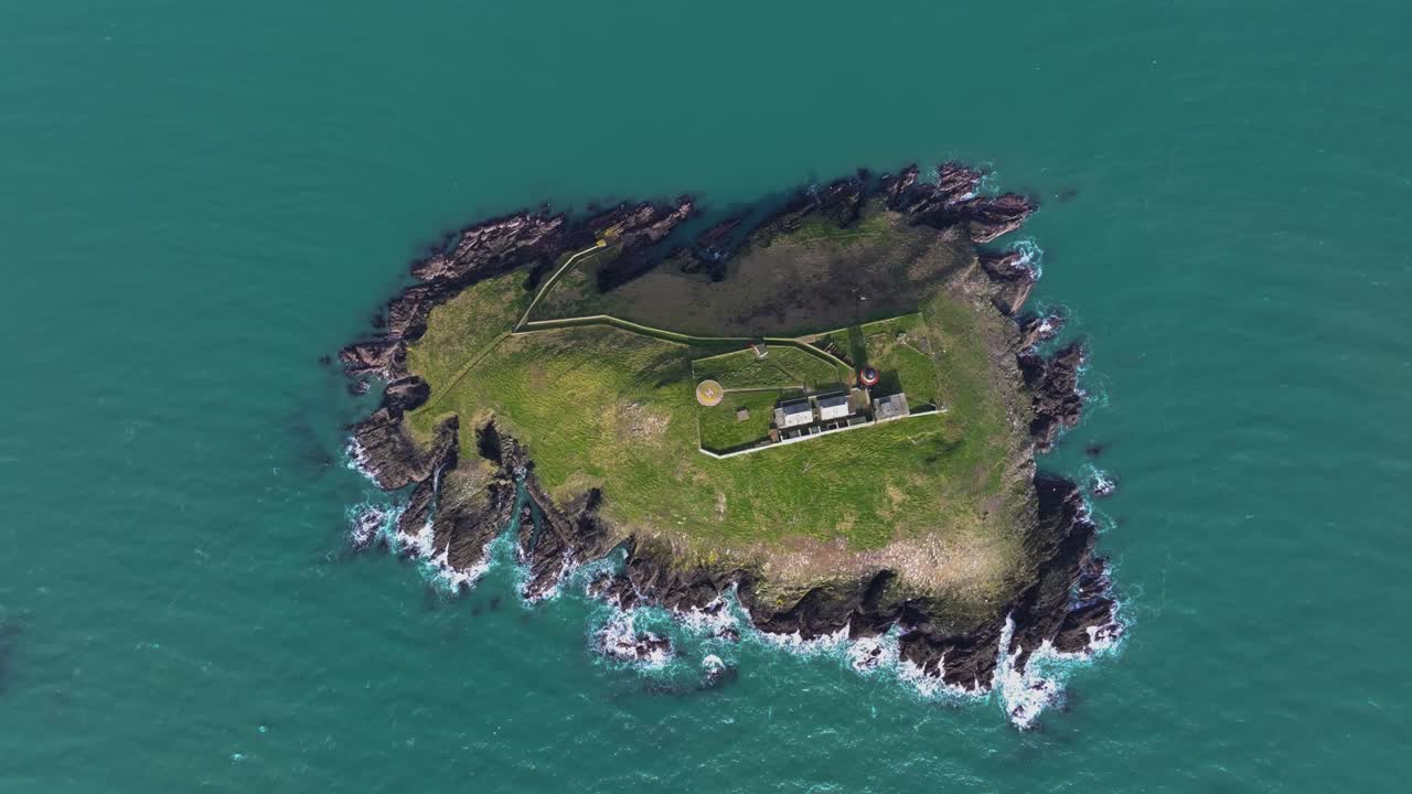 4K Cinematic Drone shot of the black Ballycotton Lighthouse overlooking the Atlantic Ocean, a symbol of Ireland’s maritime heritage Co.Cork - Ireland_24