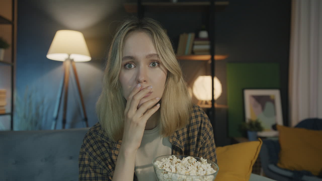 Woman Watching a Sad Movie with Popcorn