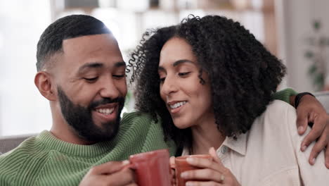 Relax,-hug-and-couple-on-a-sofa-with-coffee