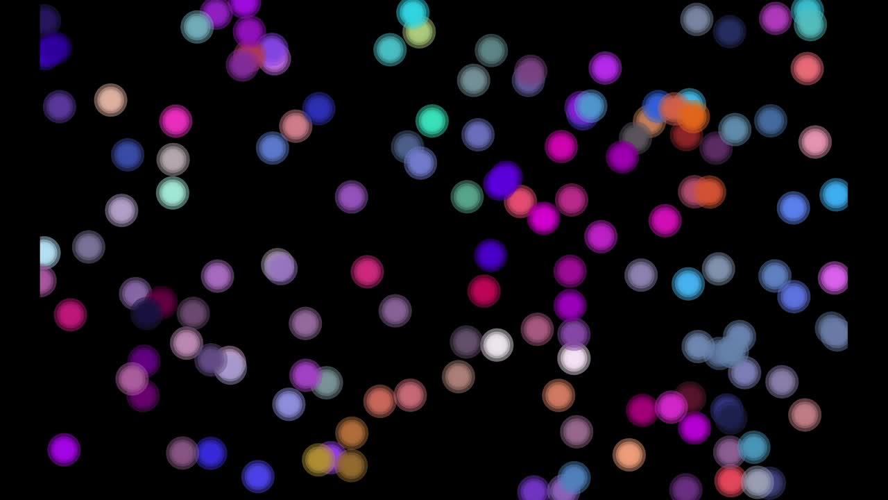 Abstract colorful dots displaying in the black background.