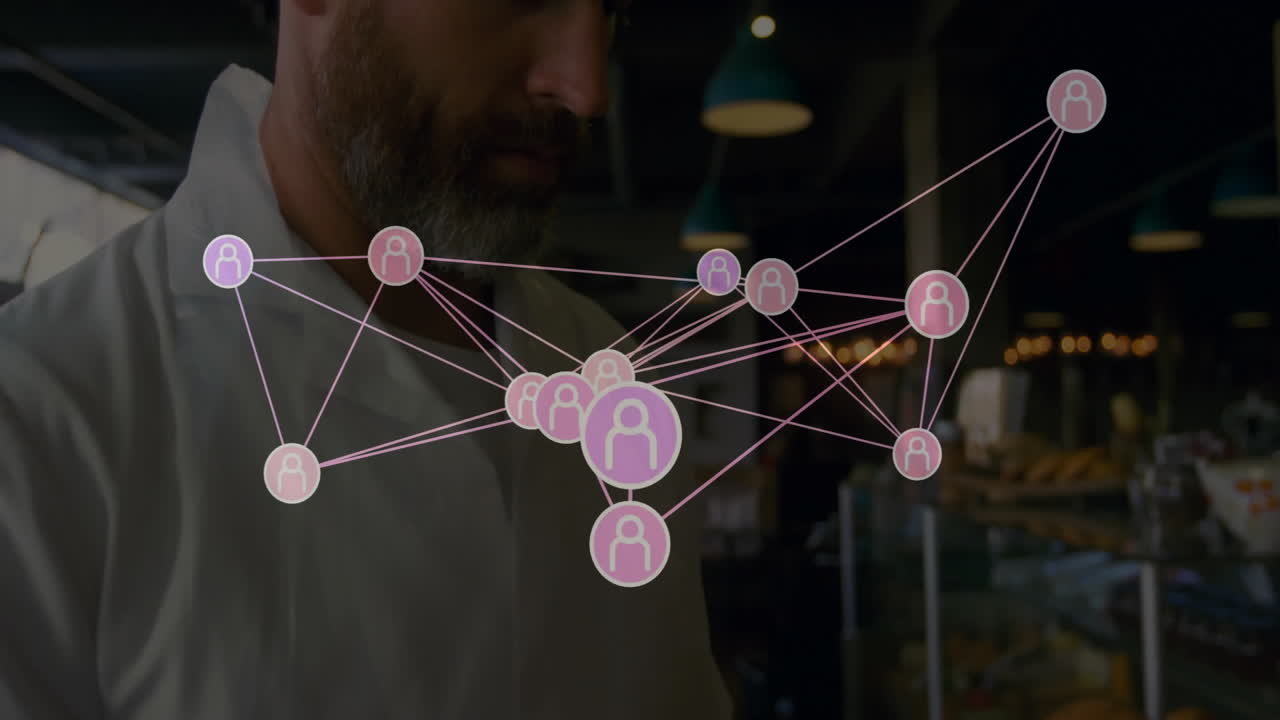 man wearing white lab coat exploring technology network overlay in bakery, showing user-icon nodes