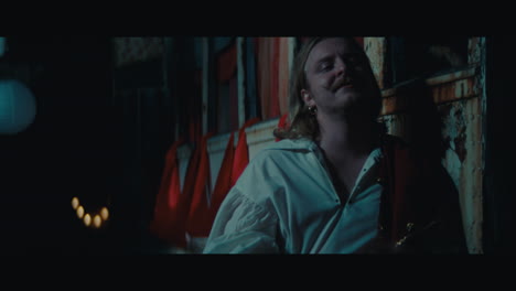 a man witch mustache in the empty gypsy circus camp at night
