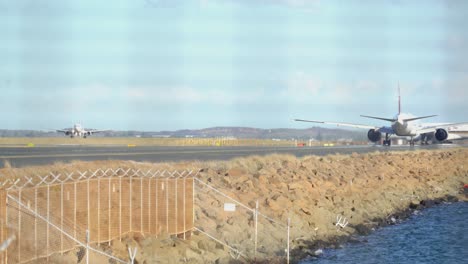 planes line up on the runway for take off
