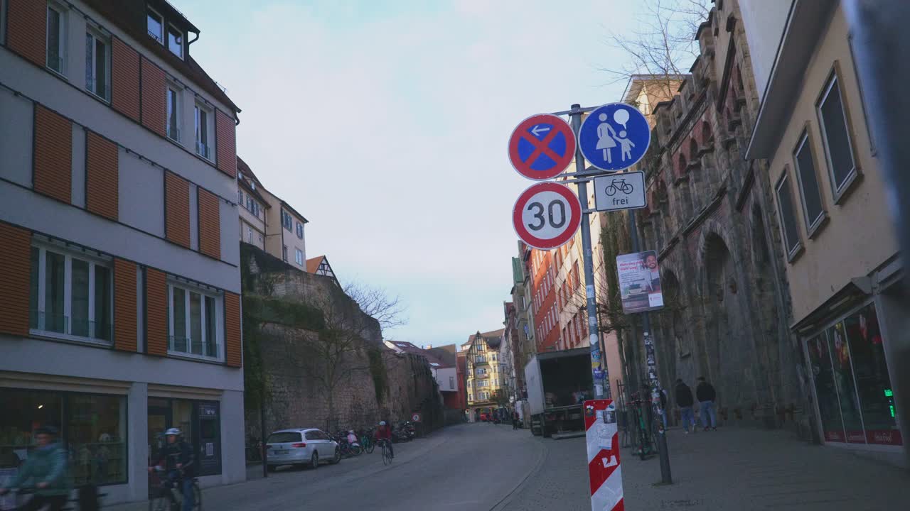 Historic Town of Tubingen Germany | Tourists Riding Bikes on Street At Sunset