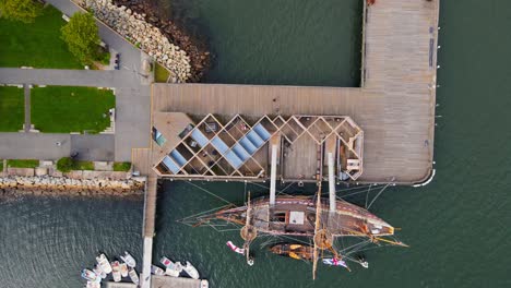 Mayflower-II-wooden-17th-century-ship-docked-in-Plymouth,-USA-Aerial-birds-eye-view