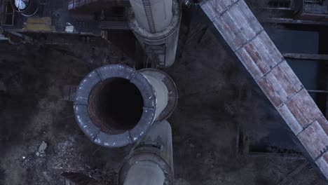 top shot over smokestack towers and abandoned factory