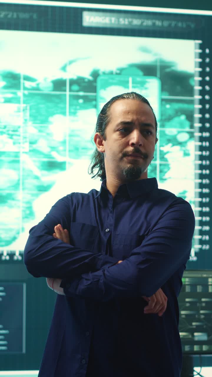Professional Man Monitoring Data on Large Screens in Control Room