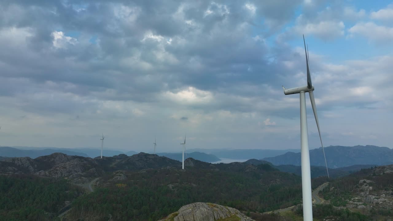 Aerial View of Wind Turbines on Mountainous Landscape