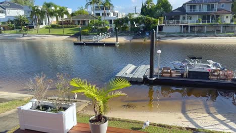 peaceful riverside scene with boats and houses