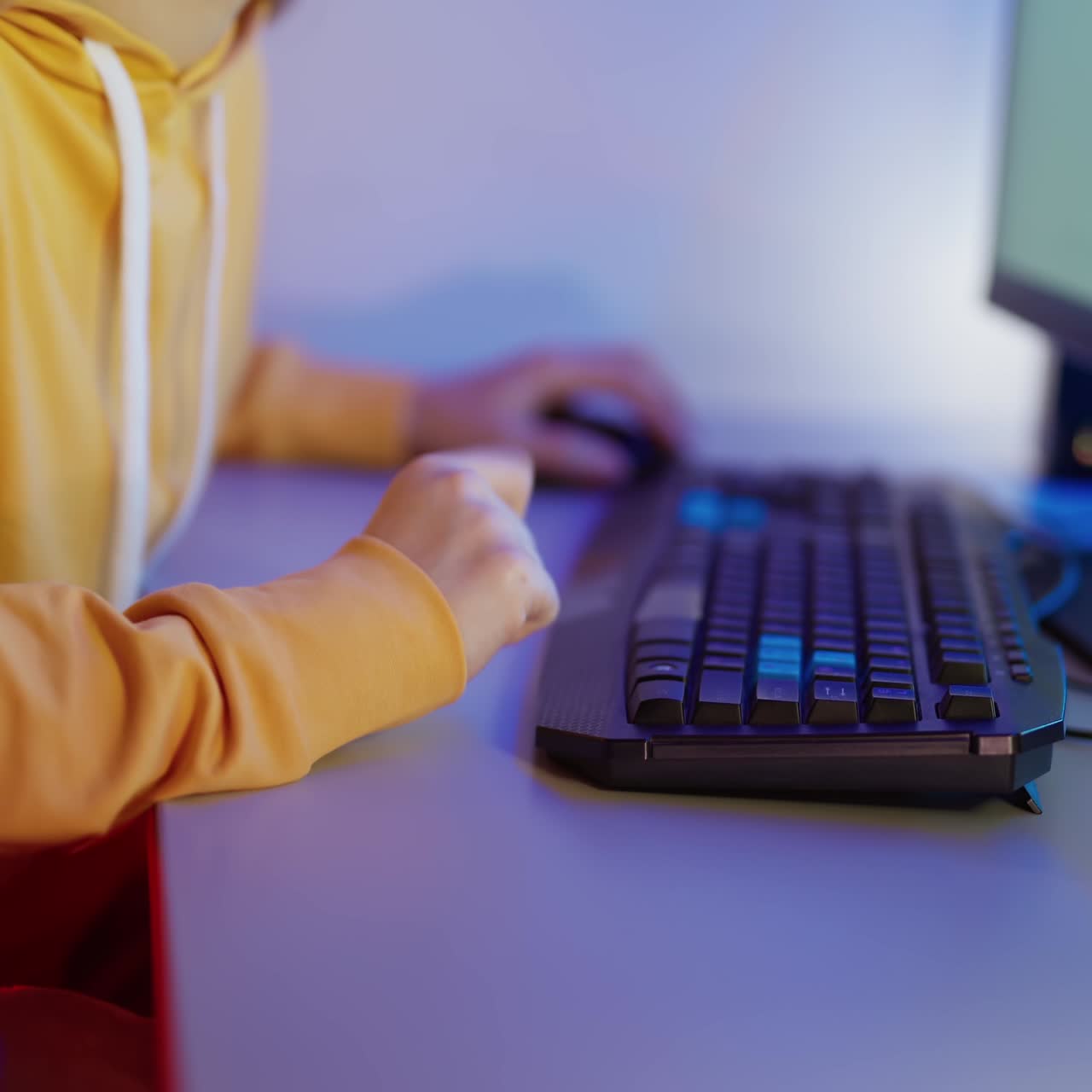 Young woman keyboarding on computer