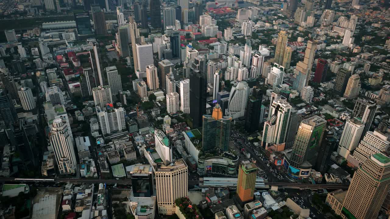 Aerial Scenic Drone Footage of the Skyline of Downtown Bangkok, Thailand Covered in Smog during Sunset during the Smokey Burning Season