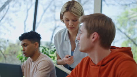 corporate supervisor consulting man office close up. mentor woman giving advices