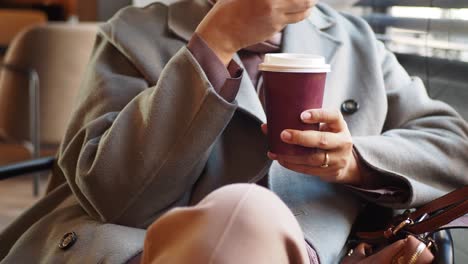 woman sitting in cafe with a cup of coffee