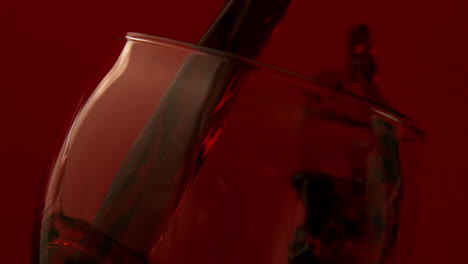 red wine pouring into wine glass