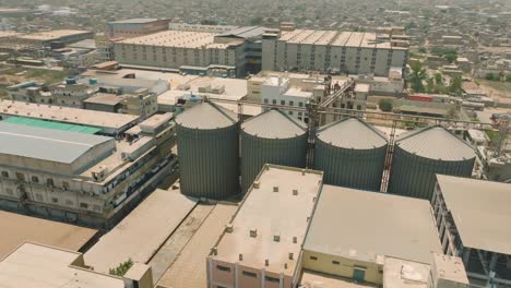 cylindrical structure storage silos at industrial area, karachi, aerial view