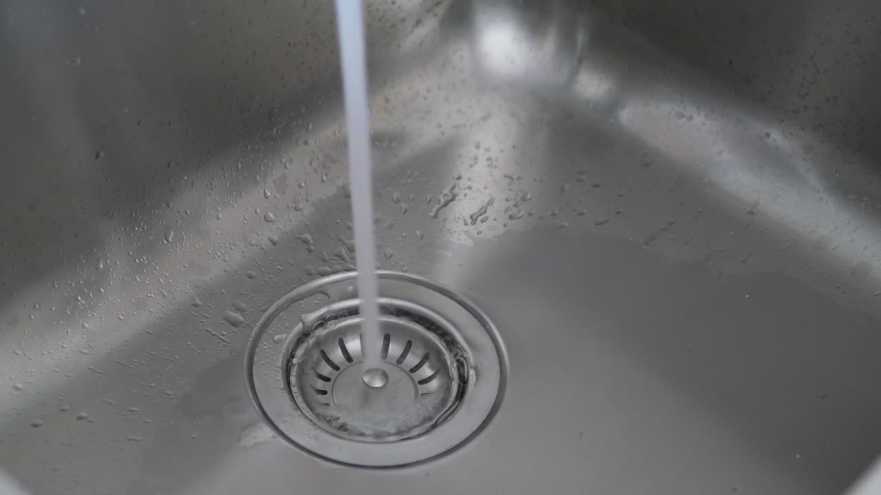 Water Running in Stainless Steel Sink