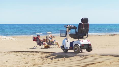 electric wheelchair on the beach background the sea