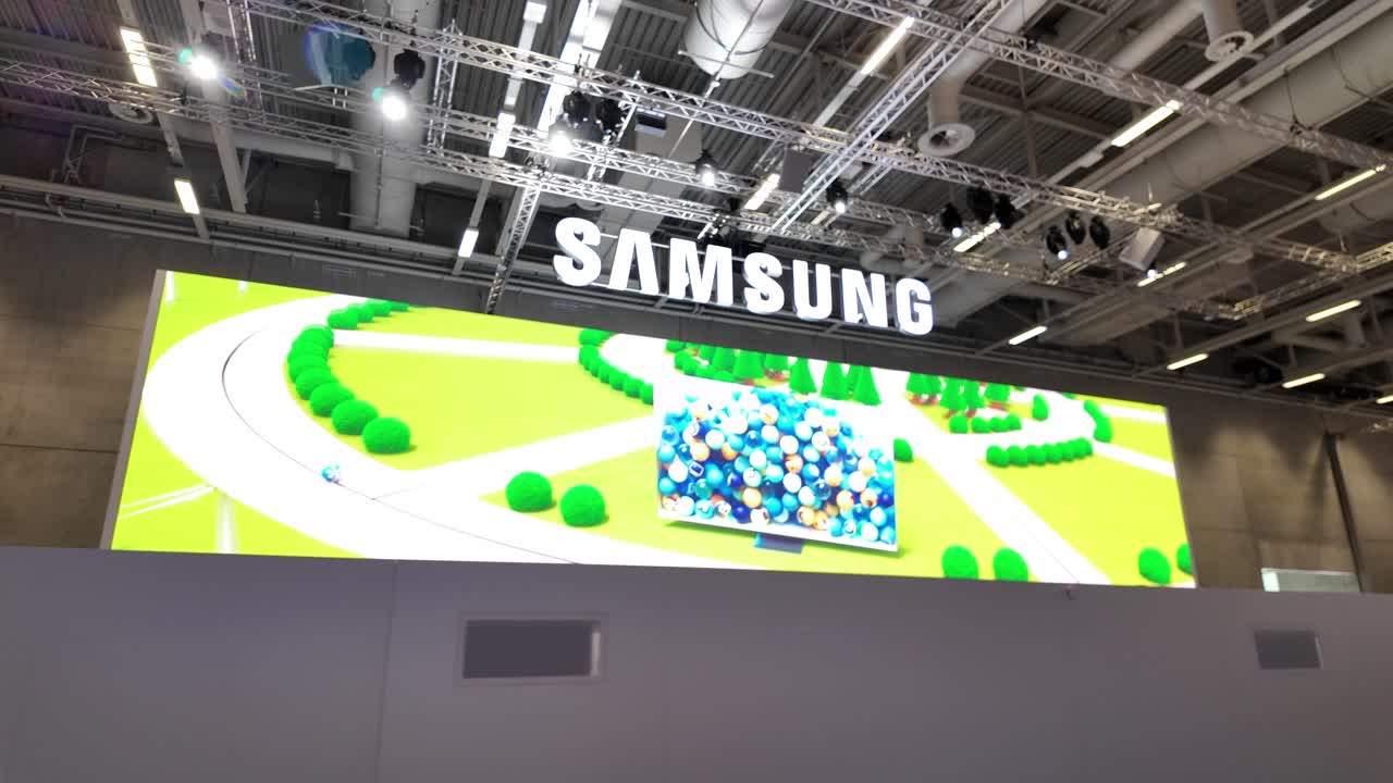 Bustling Samsung exhibit at IFA, Berlin, with attendees engaging with displays
