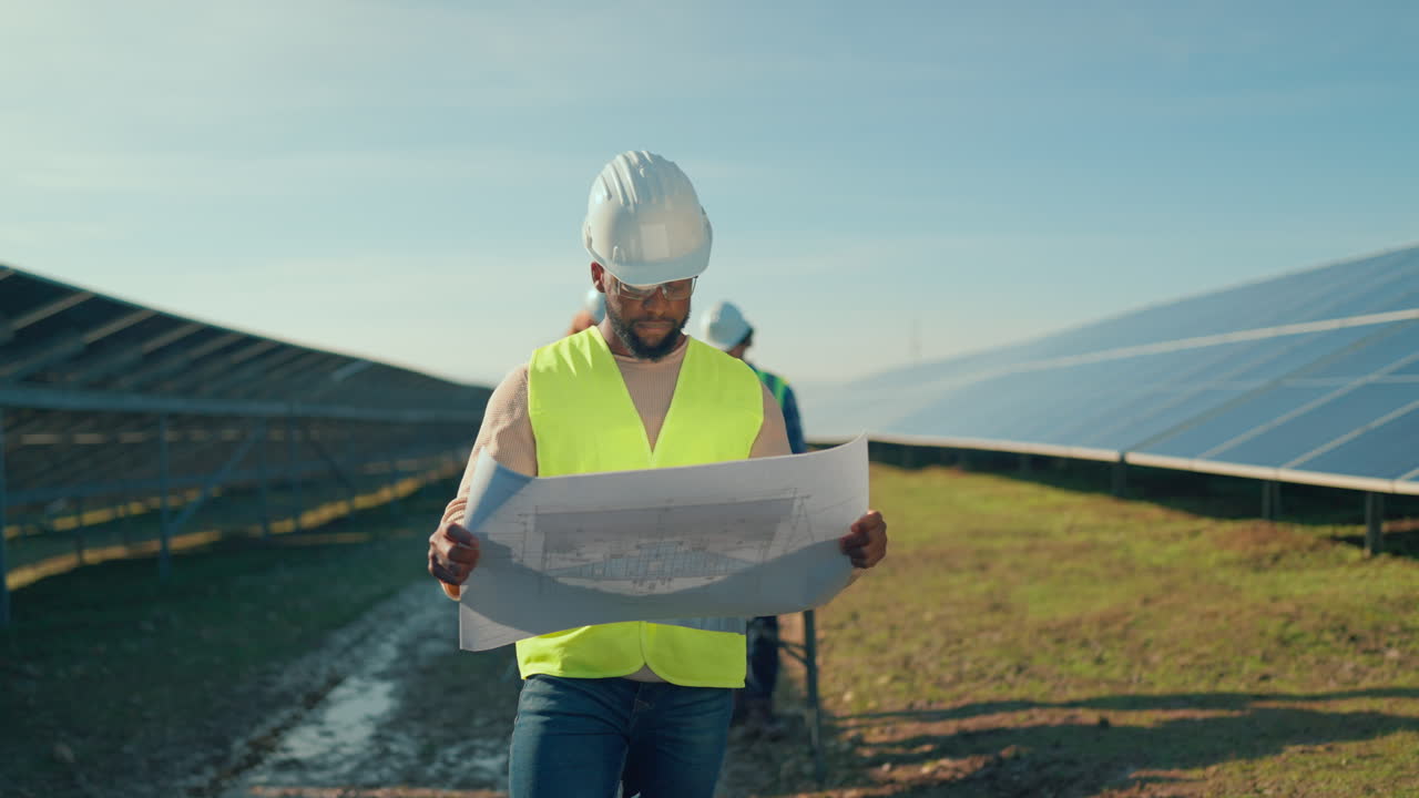 Engineers Inspecting Solar Panel Field