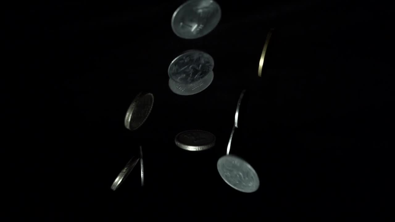 all coins are throwing up to the camera