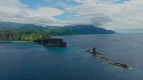 establishing aerial view of shakotan japanese green cliff, sea landscape with famous stone caves