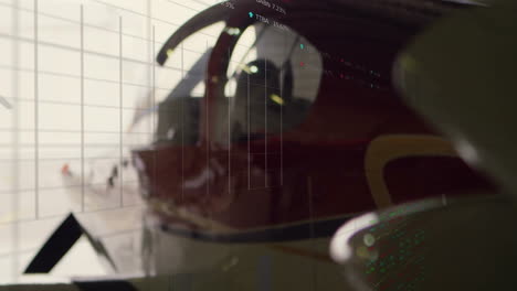 in airplane cockpit, data processing animation overlaying flight instruments, showing details