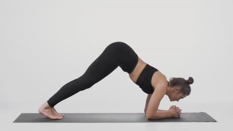 woman performing downward-facing dog yoga pose