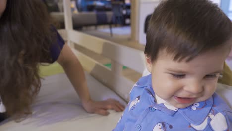 A-mother-playing-with-her-baby-with-a-toy.