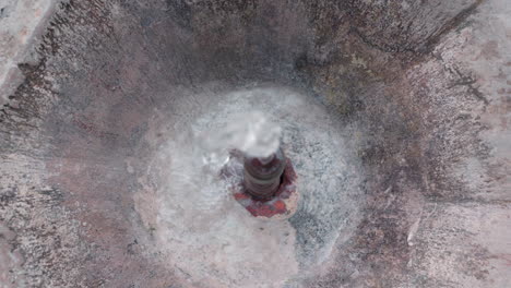 water coming out from a small fountain