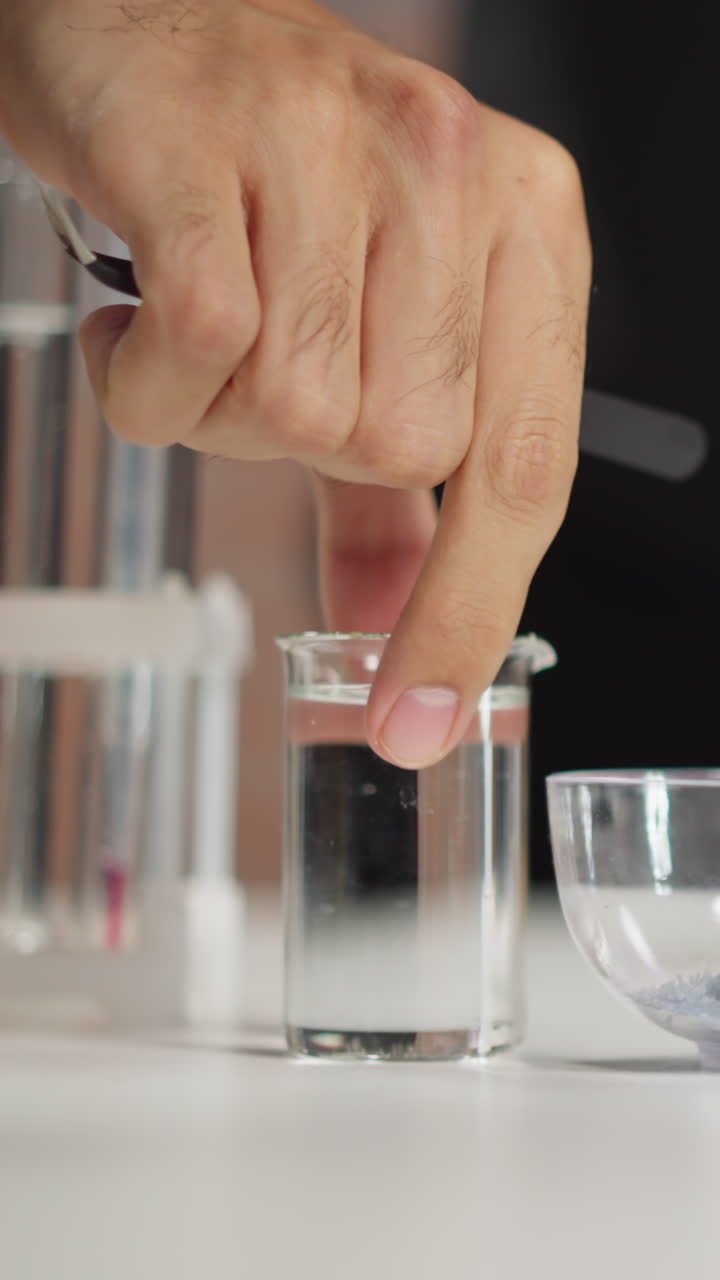 Lab assistant prepares equipment and materials for scientific experiments on table in laboratory of pharmaceutical plant closeup slow motion