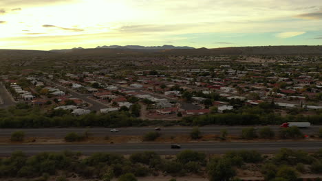 nogales highway going through town of green valley, arizona, aerial shot at sunrise