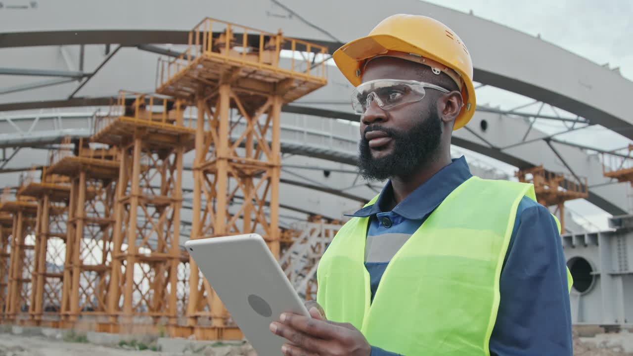 African-American Construction Site Supervisor with Table