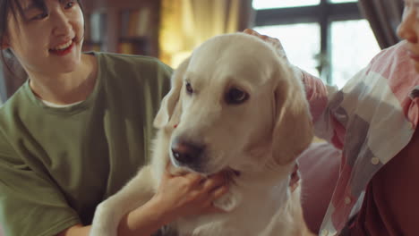 happy asian women petting dog at home