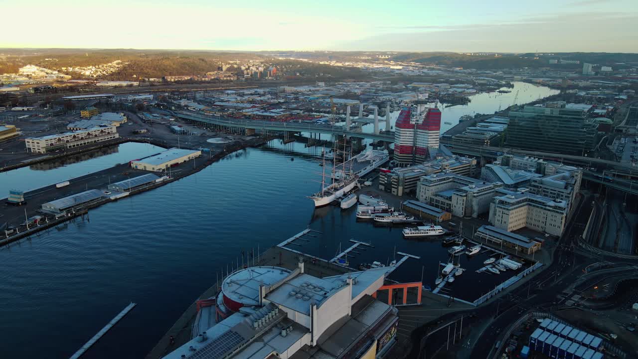 Boats At Ferry Terminal By Gota Alv River Near Lilla Bommen And Bridge At Gothenburg, Sweden
