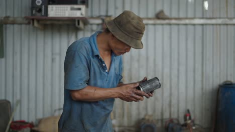 mechanic working on a vehicle in a workshop