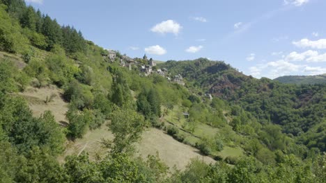 la vinzelle aerial view of french woodland mountain small town rising dolly right