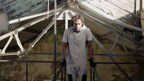 Young-Man-Is-Pulling-Up-Using-Outdoors-Metal-Construction