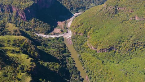 river-in-the-middle-of-the-canyon,-aerial-view-with-drone