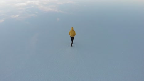 walking in a salt flat during sunrise in bolivia