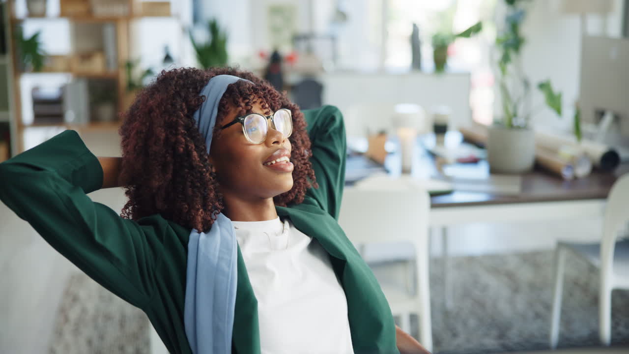Happy Black Woman Stretching and Relaxing in Modern Office